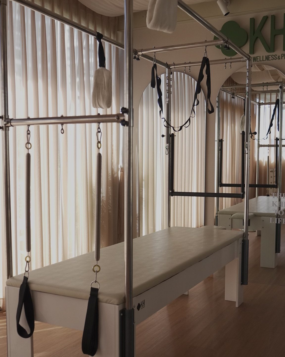 A Cadillac in the KHI studio, with arched mirrors and sheer curtains